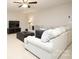 Cozy living room area with neutral carpet, a large comfy sofa, and a dark leather ottoman at 5063 Gribble Ln, Lancaster, SC 29720