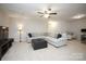 Spacious living room featuring a comfortable sofa, ottoman, and neutral decor at 5063 Gribble Ln, Lancaster, SC 29720