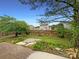Backyard with patio, manicured landscaping, and privacy fence at 5075 Meanna Dr, Clover, SC 29710