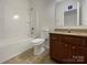 Clean bathroom with a tub/shower combo, granite vanity, and tile flooring at 5075 Meanna Dr, Clover, SC 29710