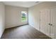 Cozy carpeted bedroom features a window with a view and a closet with double doors at 5075 Meanna Dr, Clover, SC 29710