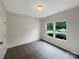 Bright bedroom with carpet, white trim, and two windows offering natural light at 5075 Meanna Dr, Clover, SC 29710