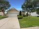 Charming single-story home with a well-manicured front yard and attached two-car garage at 5075 Meanna Dr, Clover, SC 29710