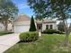 Charming single-story home with manicured landscaping and a well-maintained front yard at 5075 Meanna Dr, Clover, SC 29710