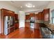 Modern kitchen with stainless steel appliances, granite countertops, and wooden cabinets at 5075 Meanna Dr, Clover, SC 29710