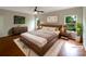 Cozy primary bedroom with hardwood floors, large window, and stylish furnishings at 5075 Meanna Dr, Clover, SC 29710
