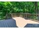 Relax or entertain on this rear deck surrounded by mature trees and wooded views at 5321 Kathryn Blair Ln, Charlotte, NC 28226