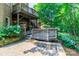 Multiple decks in the backyard with lots of green space, landscaping, and brick paver patio at 5321 Kathryn Blair Ln, Charlotte, NC 28226