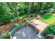 Enjoy wooded views from this custom rear deck with a patio in the fenced backyard at 5321 Kathryn Blair Ln, Charlotte, NC 28226