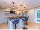 Finished basement featuring a stylish bar with ample seating and unique decor at 5321 Kathryn Blair Ln, Charlotte, NC 28226