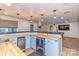 Entertain in this finished basement with modern bar, butcher block counters, and stainless beverage center at 5321 Kathryn Blair Ln, Charlotte, NC 28226