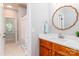 Bathroom with wood vanity, large mirror, and walk-in shower that provides comfort and style at 5321 Kathryn Blair Ln, Charlotte, NC 28226
