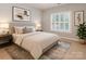 Neutral bedroom with a large window and decor at 5321 Kathryn Blair Ln, Charlotte, NC 28226
