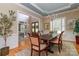 Elegant dining room with natural light, classic wood table, and decorative accents, ideal for Gathering meals at 5321 Kathryn Blair Ln, Charlotte, NC 28226