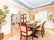 Traditional dining room with hardwood floors, chandelier, and view to the entry at 5321 Kathryn Blair Ln, Charlotte, NC 28226