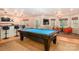 Spacious game room features a pool table, bar area, and comfortable seating at 5321 Kathryn Blair Ln, Charlotte, NC 28226