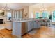 Modern kitchen with stainless steel appliances and a breakfast bar overlooking the dining area at 5321 Kathryn Blair Ln, Charlotte, NC 28226
