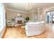 Bright and airy living room with a fireplace, hardwood floors, and large windows for natural light at 5321 Kathryn Blair Ln, Charlotte, NC 28226