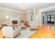 Inviting living room boasts a fireplace, chandelier, hardwood floors, and comfortable seating at 5321 Kathryn Blair Ln, Charlotte, NC 28226