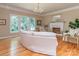 Inviting living room with hardwood floors, fireplace, and large windows offering scenic views at 5321 Kathryn Blair Ln, Charlotte, NC 28226