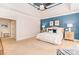 Spacious main bedroom with a tray ceiling, accent wall, and large windows at 5321 Kathryn Blair Ln, Charlotte, NC 28226