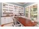 Bright home office with custom built-ins, a large window, and a spacious desk at 5321 Kathryn Blair Ln, Charlotte, NC 28226