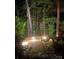 Cozy patio with ambient lighting and natural landscaping perfect for enjoying evenings outdoors at 5321 Kathryn Blair Ln, Charlotte, NC 28226
