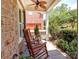 Inviting front porch with rocking chairs and a view of the landscaped yard at 5321 Kathryn Blair Ln, Charlotte, NC 28226