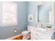 Charming powder room featuring a stylish vanity, framed mirror, and window for natural lighting at 5321 Kathryn Blair Ln, Charlotte, NC 28226