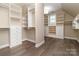 Spacious walk-in closet features custom shelving, drawers, and ample storage space at 5321 Kathryn Blair Ln, Charlotte, NC 28226