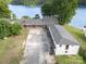 Aerial view showcasing the property's extensive grounds and proximity to the serene lake at 565 Shore Acres Rd, Salisbury, NC 28146