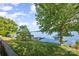 Lush backyard with a stunning lake view and private dock, perfect for nature enthusiasts at 565 Shore Acres Rd, Salisbury, NC 28146