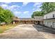 Charming brick home with a covered front porch and a large driveway, offering ample outdoor space at 565 Shore Acres Rd, Salisbury, NC 28146