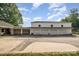 Exterior of a spacious garage with multiple bays, adjacent to a large driveway for convenient parking at 565 Shore Acres Rd, Salisbury, NC 28146