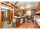 Rustic kitchen features brick walls, wood cabinets, and a window with natural light at 565 Shore Acres Rd, Salisbury, NC 28146