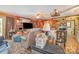 Living room includes wood paneled walls, ceiling fans, a fireplace and lots of personal items at 565 Shore Acres Rd, Salisbury, NC 28146