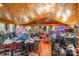 Large living room with high ceilings, wooden floors and several windows overlooking the property at 565 Shore Acres Rd, Salisbury, NC 28146