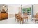 Dining room with traditional furniture, large windows, and access to an outdoor deck at 5903 Wm Griffin Rd, Monroe, NC 28112