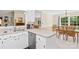 Bright kitchen with stainless steel dishwasher, light countertops, and a breakfast area overlooking the backyard at 5903 Wm Griffin Rd, Monroe, NC 28112