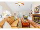 Bright living room with fireplace, tv, hardwood flooring, open floor plan, and natural light at 5903 Wm Griffin Rd, Monroe, NC 28112