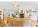 Living room with vaulted ceilings, built ins, fireplace, and natural lighting at 5903 Wm Griffin Rd, Monroe, NC 28112