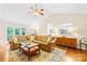 Inviting living room with a vaulted ceiling, wood floors and a view to the kitchen at 5903 Wm Griffin Rd, Monroe, NC 28112