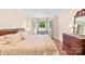 Serene bedroom featuring a comfortable bed, large window, and hardwood floors at 5903 Wm Griffin Rd, Monroe, NC 28112