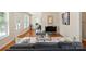 Sunlit living room showcasing modern furnishings, wood floors, and elegant decor at 6034 Tuckaseegee Rd, Charlotte, NC 28208
