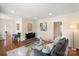 Inviting living room with hardwood floors, stylish decor, and abundant natural light at 6034 Tuckaseegee Rd, Charlotte, NC 28208