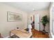 Stylish home office featuring hardwood floors, natural light, and a minimalist design at 6034 Tuckaseegee Rd, Charlotte, NC 28208