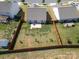 Large fenced backyard with healthy lawn and a patio with furniture at 6719 Jerimoth Dr, Charlotte, NC 28215