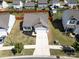 Aerial view of home with well-maintained yard, landscaping, and driveway at 6719 Jerimoth Dr, Charlotte, NC 28215