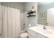 Clean and well-lit bathroom with a shower/tub combo, a white vanity, and lots of storage at 6719 Jerimoth Dr, Charlotte, NC 28215