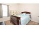 Bright bedroom with a dresser and bed featuring a floral bedspread next to a large window at 6719 Jerimoth Dr, Charlotte, NC 28215